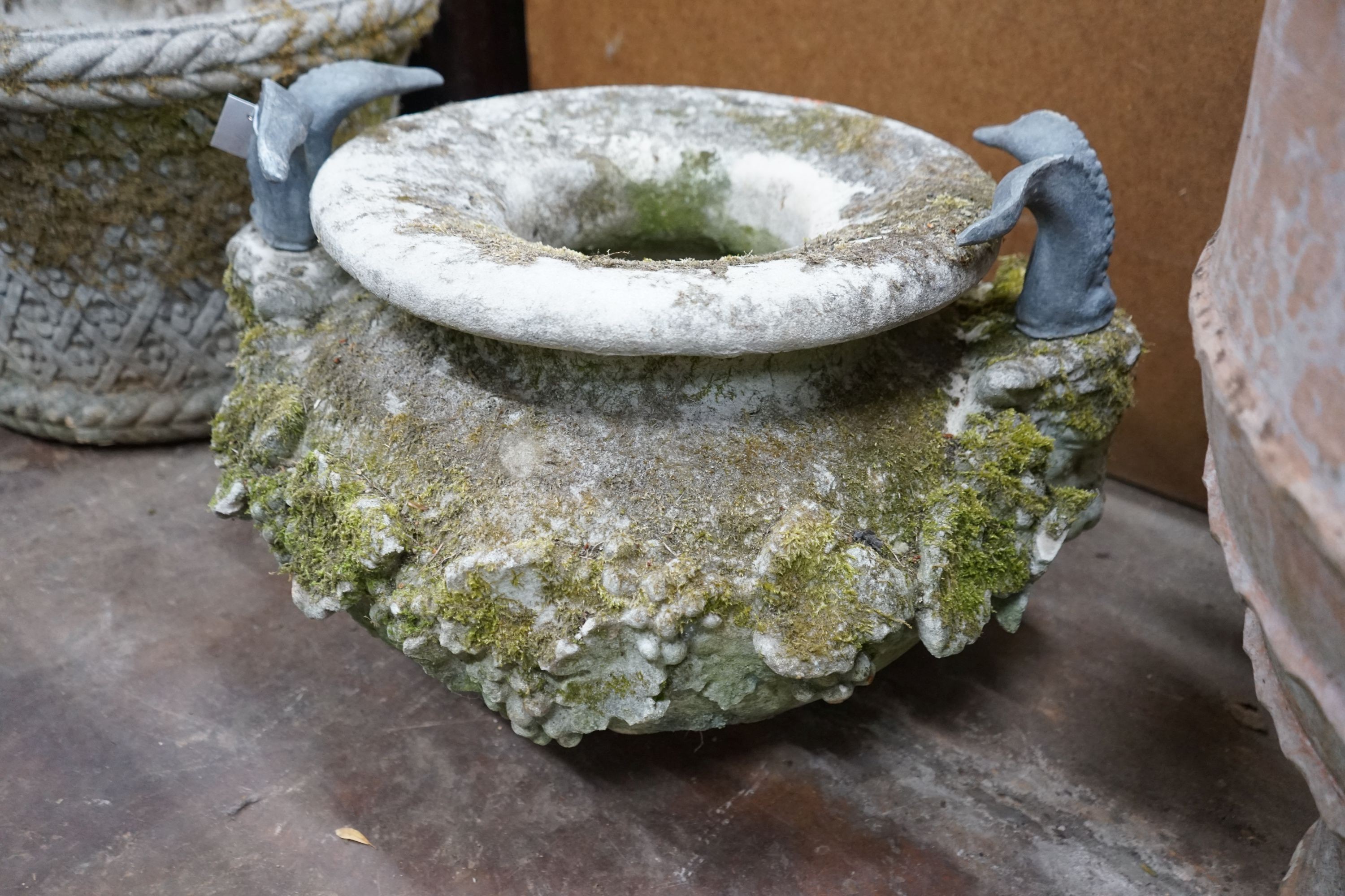 A large circular reconstituted stone ram's head garden planter / fountain head, diameter 66cm, height 42cm